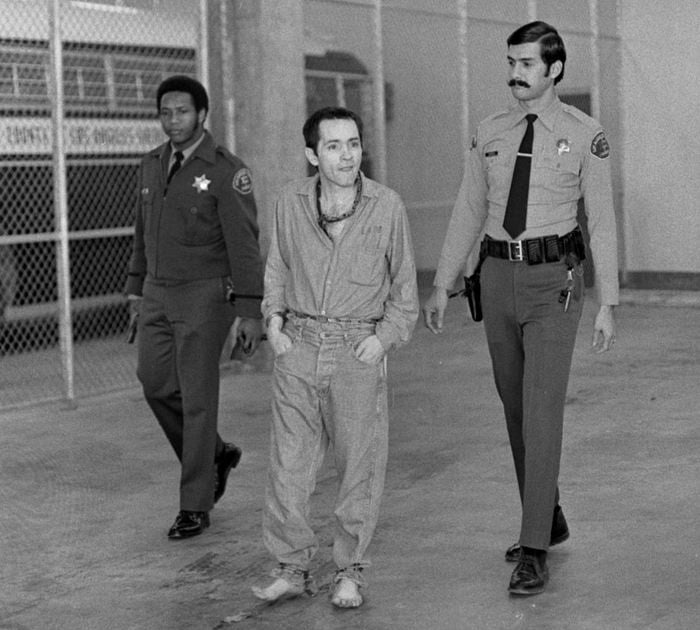 Charles Manson escorted