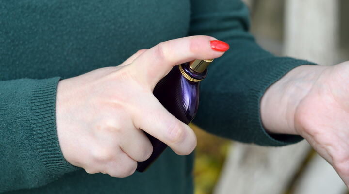 Girl use Tom Ford velvet orchid fragrance perfume bottle.