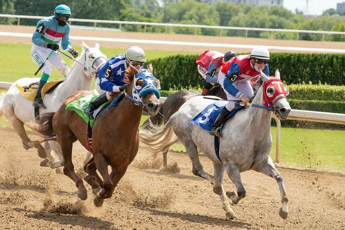 Men Riding on Horses on Race